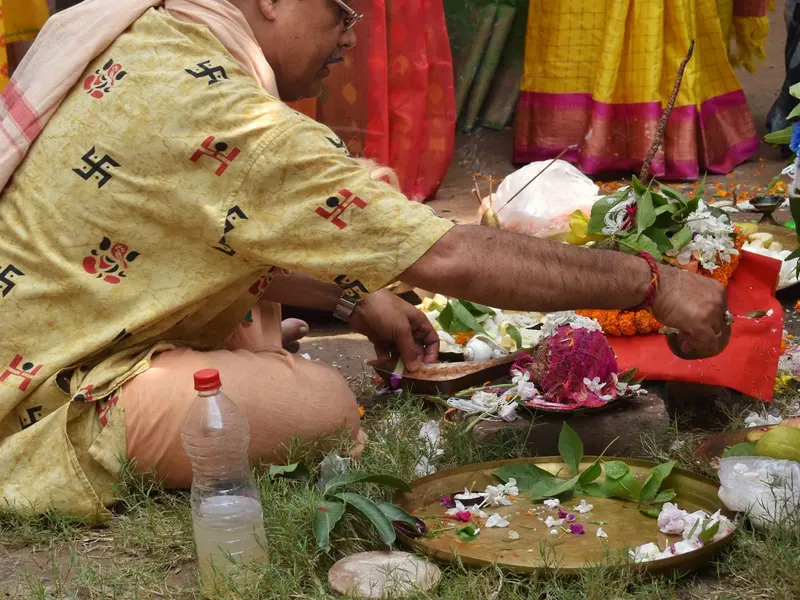 A puja being performed on open ground